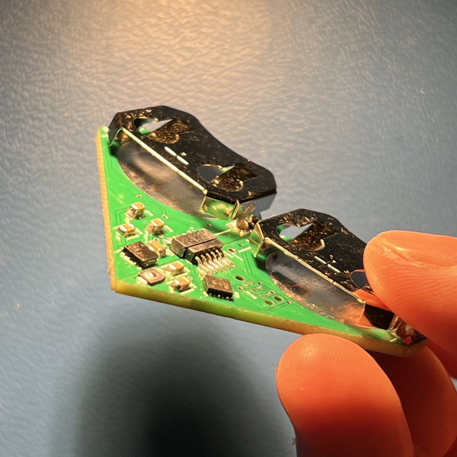 Top side of keychains connected, held at an angle